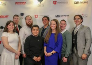 West High board members and scholarship recipients stand in front of a banner at the 2019 Union Scholarship Celebration. 